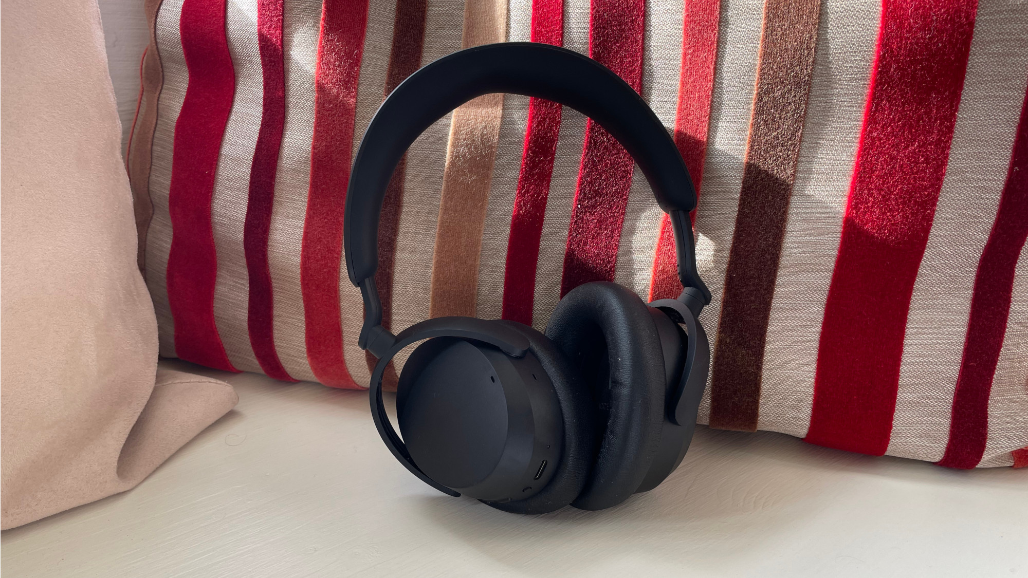 Sennheiser Accentum on a stripey cushion