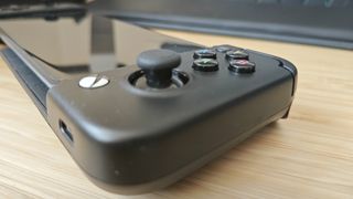 A black GameSir X2 Pro controller sitting on a desk