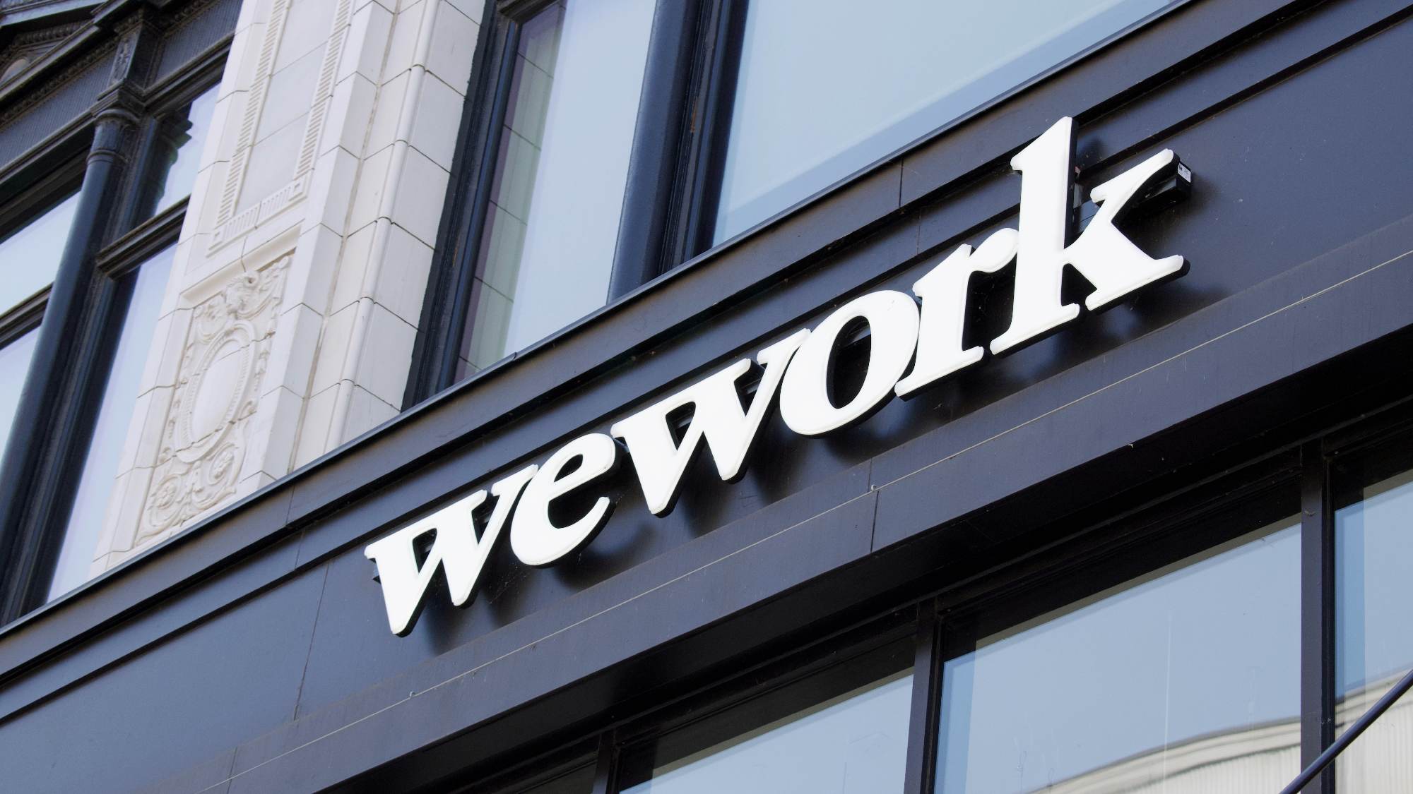 The WeWork logo on a building