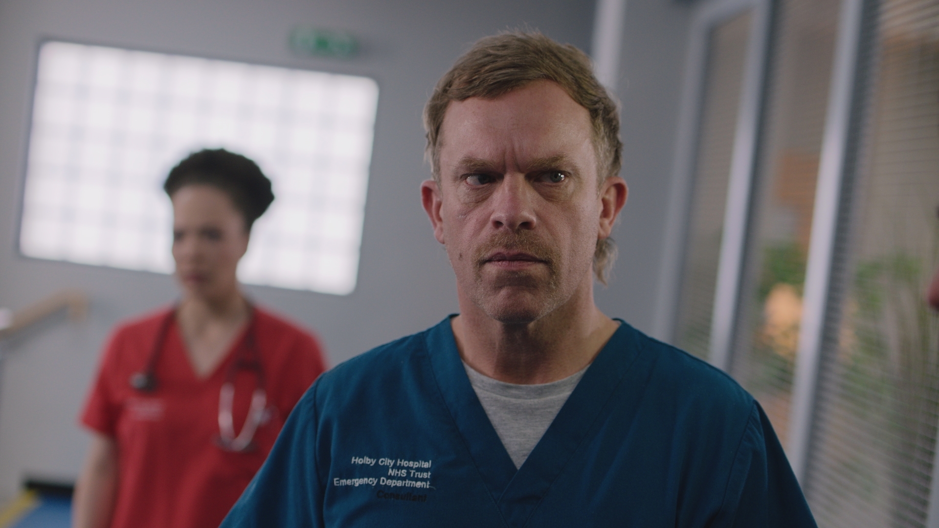 Dylan looks disturbed while doctor Lauren Maddox stands in the background.