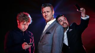 Josh Widdicombe (left) and Alex Brooker (right) play with their phones while Adam Hills (centre) strikes a pose between them in a promo image for The Last Leg