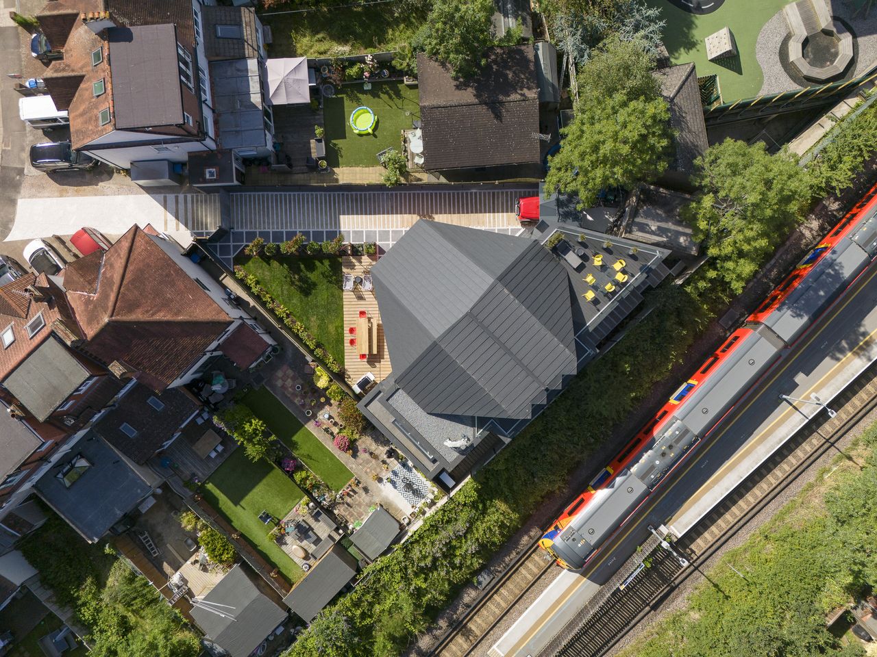 Unusual London house from above, with train passing