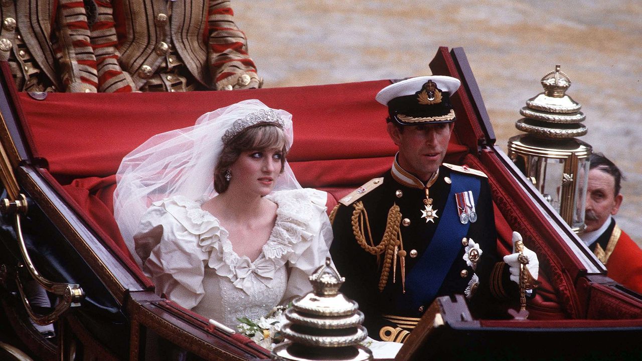 prince charles, prince of wales and diana, princess of wales, wearing a wedding dress designed by david and elizabeth emanuel and the spencer family tiara, ride in an open carriage, from st pauls cathedral to buckingham palace, following their wedding on july 29, 1981 in london, england photo by anwar husseingetty images