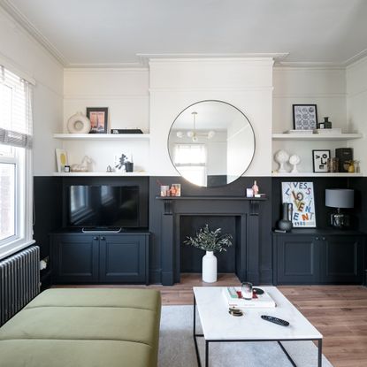 living room with black fireplace and built in storage