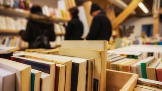 Second hand book store with blurred people in background