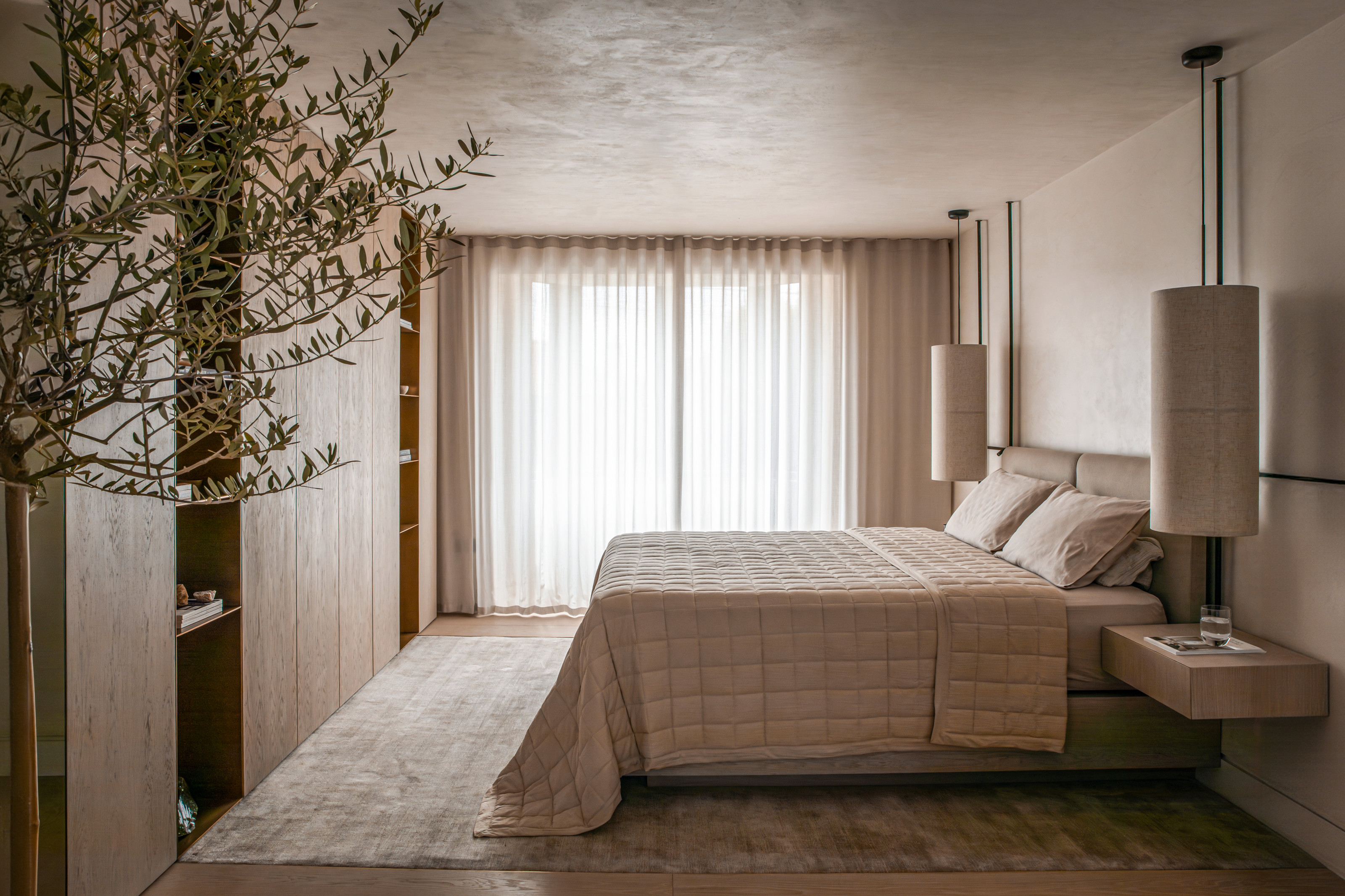 Beige bedroom with sheer curtains