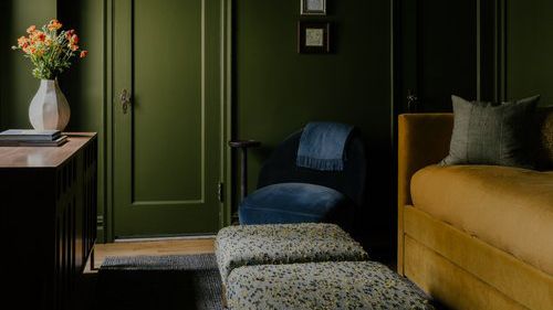 green living room with yellow couch