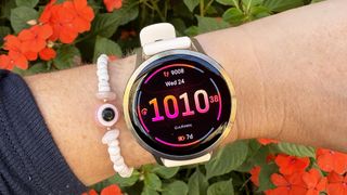 the Garmin Venu 4 in lunar gold on the wrist