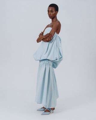 Model wears dress by Brian Tusin