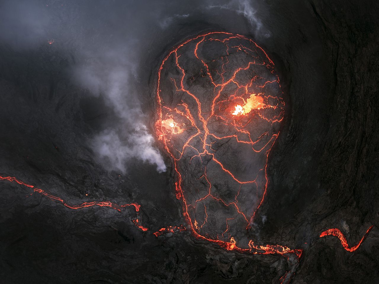 Iceland's Fagradalsfjall volcano as it cooled. The cracking pattern of the lava formed a skull, creating an eerie natural illusion for a few moment