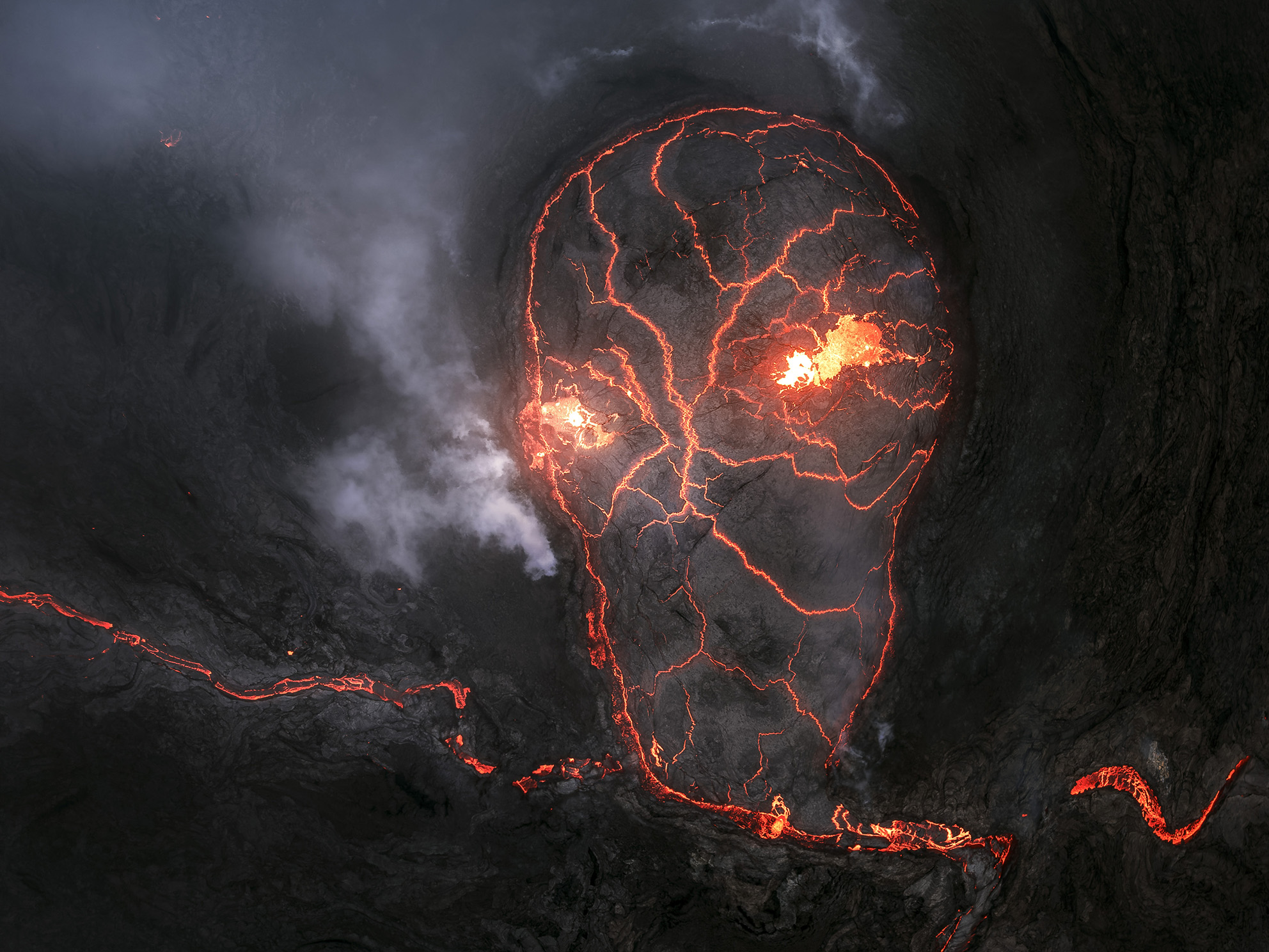 Iceland's Fagradalsfjall volcano as it cooled. The cracking pattern of the lava formed a skull, creating an eerie natural illusion for a few moment