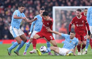 Liverpool's Wataru Endo is tackled by Manchester City's Mateo Kovacic in the teams' 1-1 draw at Anfield in March 2024.