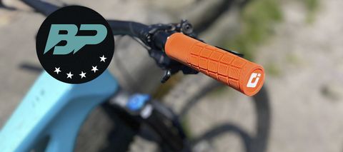 Orange ODI Reflex grip on bike handlebar