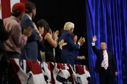 Donald Trump waves to supporters.