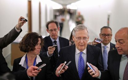 WASHINGTON, DC - NOVEMBER 30:Senate Majority Leader Mitch McConnell (R-KY) talks with reporters after leaving a tax reform news conference in the Dirksen Senate Office Building on Capitol Hil