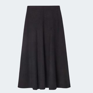 flat lay image of long black skirt