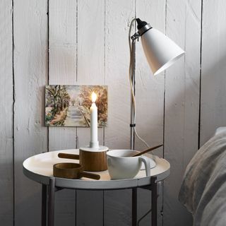 white wooden panel and bedside table