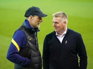 Dean Smith (right) talks with Thomas Tuchel before the match