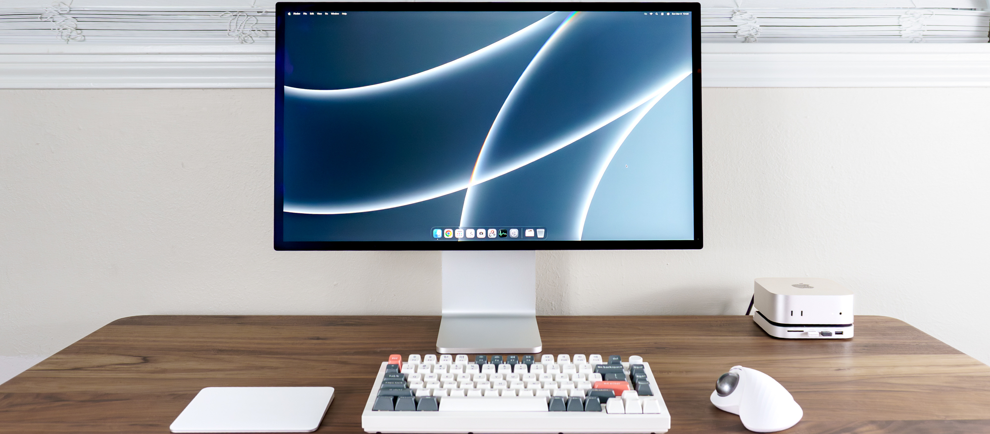 The Apple Studio Display XDR on a desk connected to a Mac mini M4