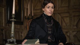 Anne Lister (Suranne Jones) in black coat and tartan waistcoat in Gentleman Jack.