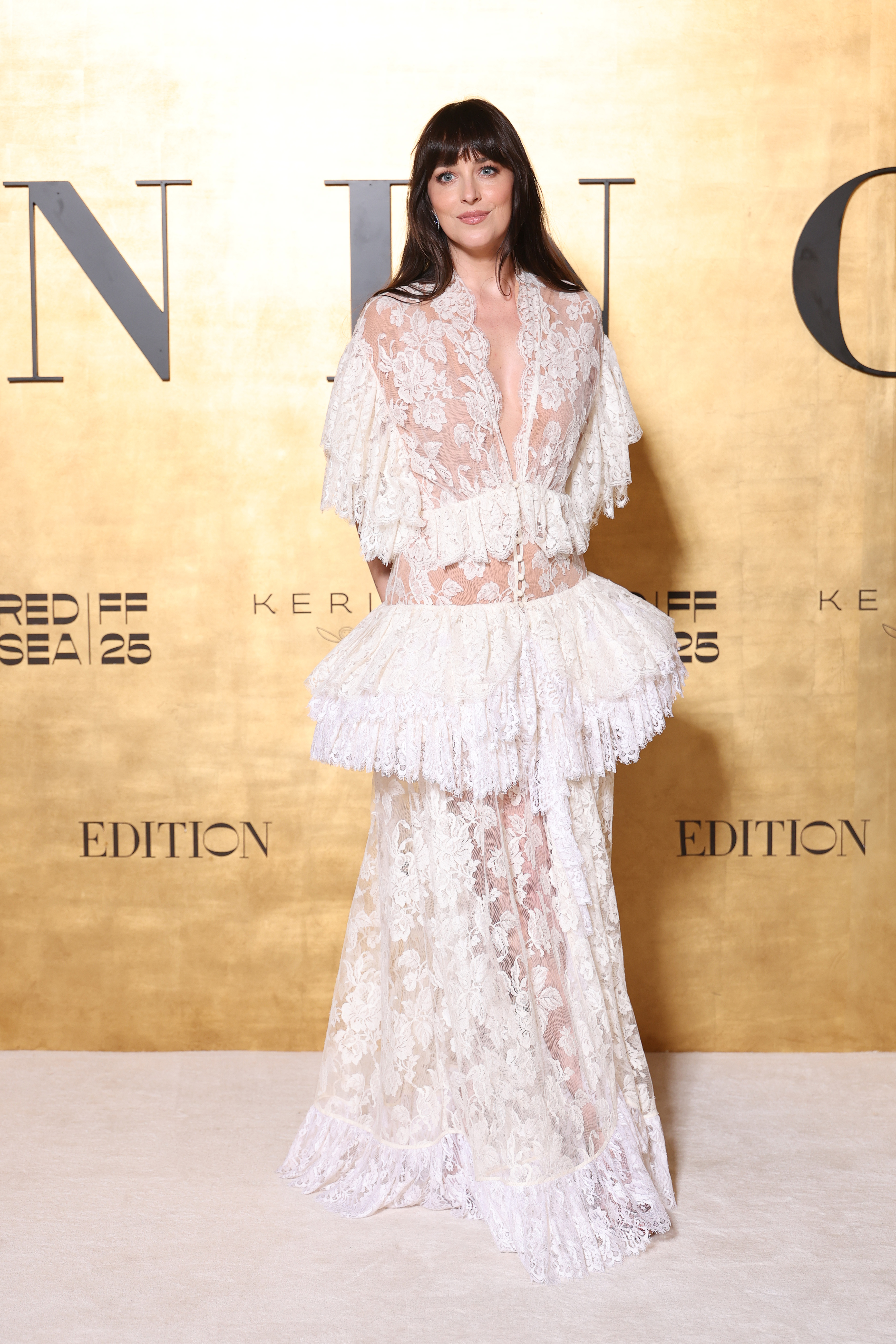 Dakota Johnson swapped her pendant necklaces for a sheer lace gown from Chlo&amp;eacute; Fall 2025