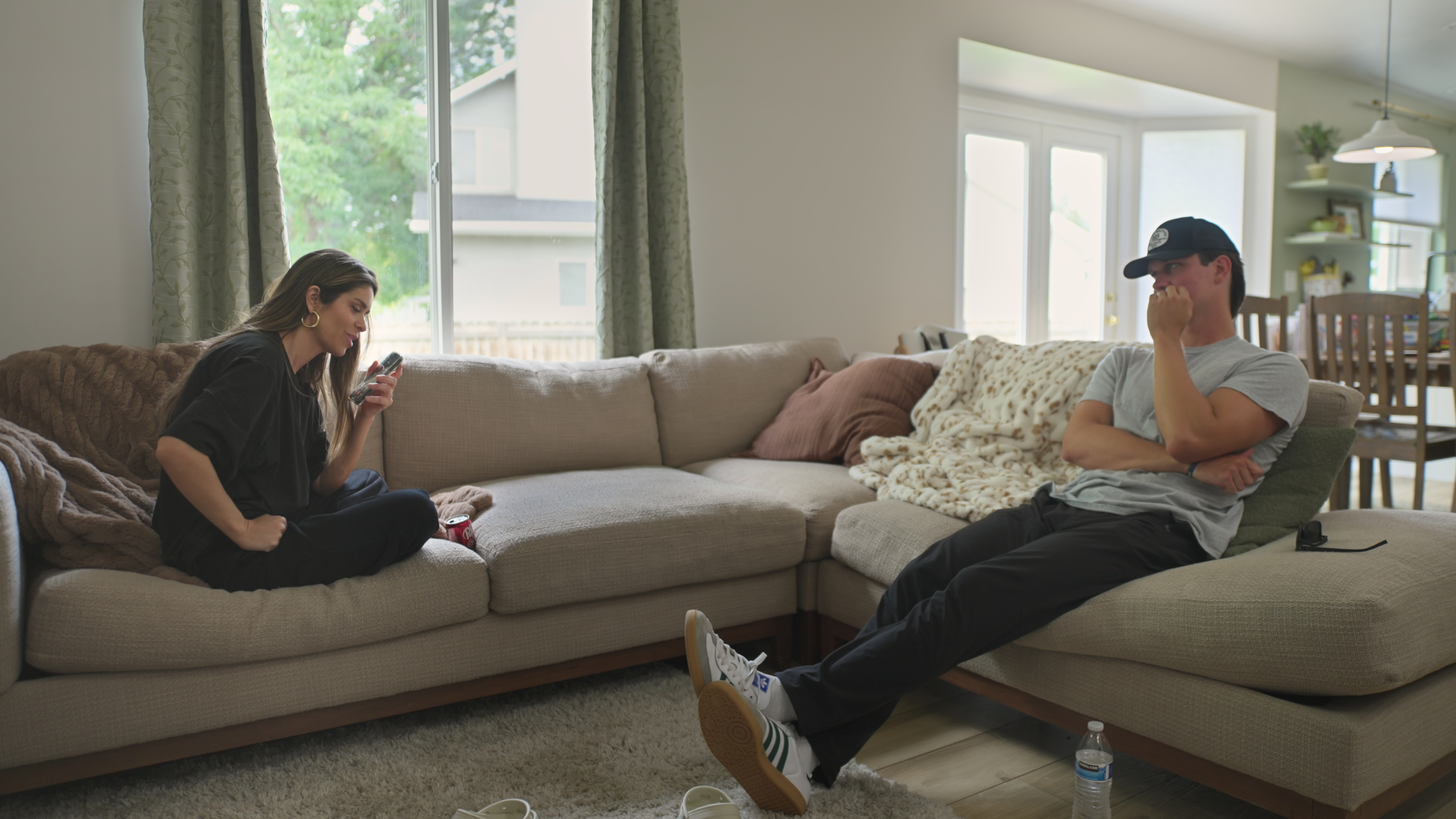 taylor frankie paul sits on the couch with tiktoker ben who she has a relationship with in the secret lives of mormon wives season 4