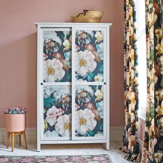 Upcycled white wooden wardrobe with floral patterned panels
