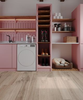 utility room space with pink cupboards and built in shoe storage