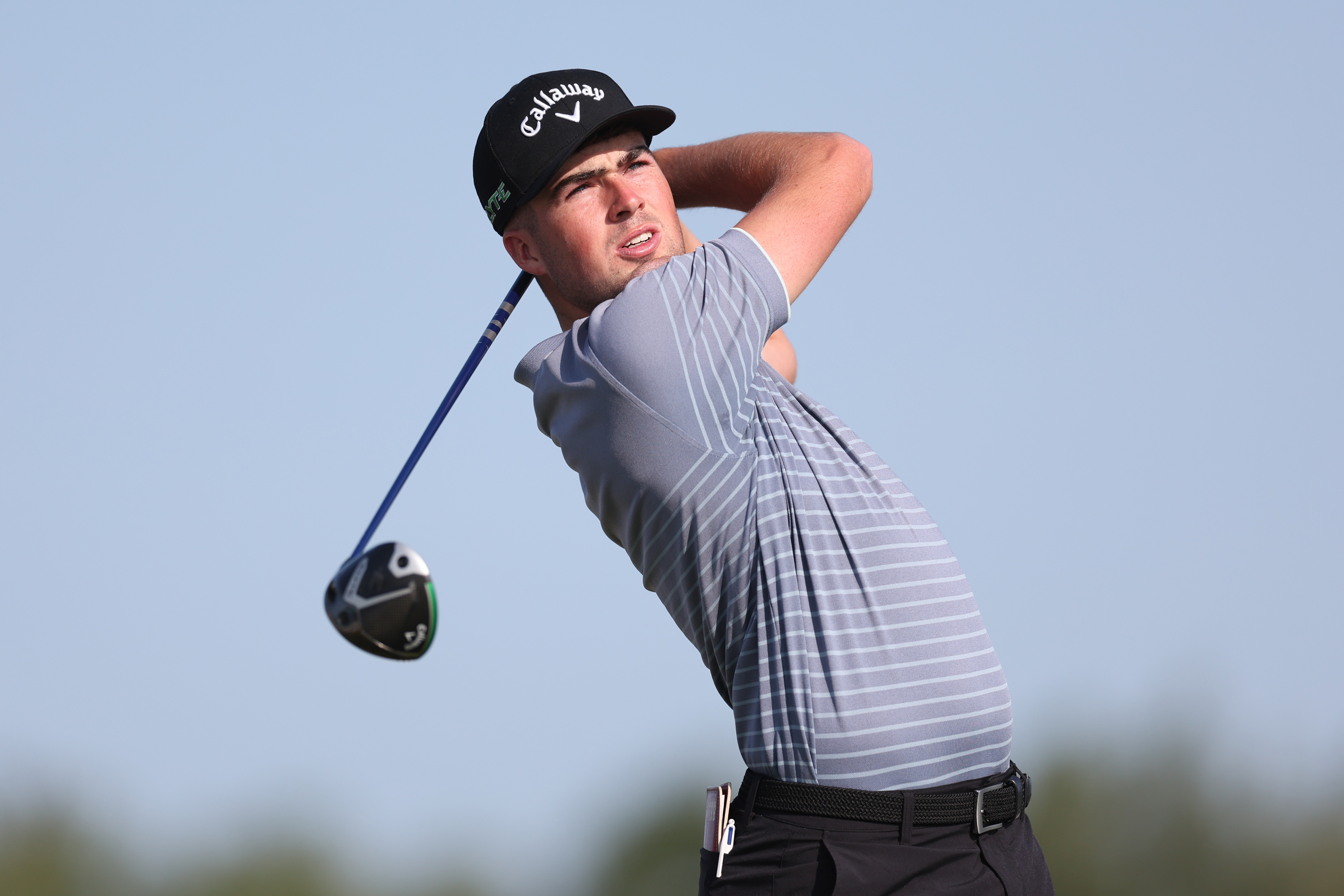 Sebastian Cave hits a tee shot with a driver