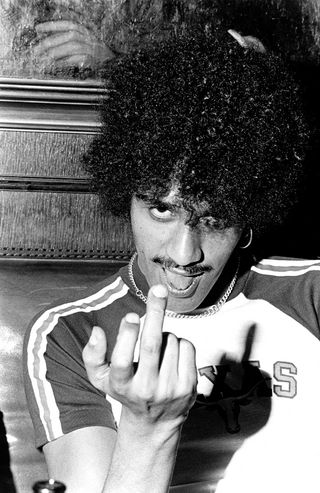 Phil Lynott giving the camera the middle finger