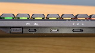 Corsair Vanguard Air 99 Wireless keyboard ports and switches close up