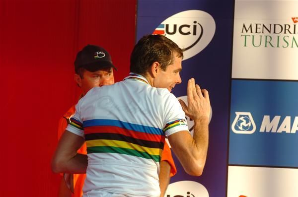 Cadel Evans (Australia) waves to his wife as he exits the podium ceremony.