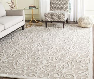 martha stewart safavieh rug with a sofa and chairs on it