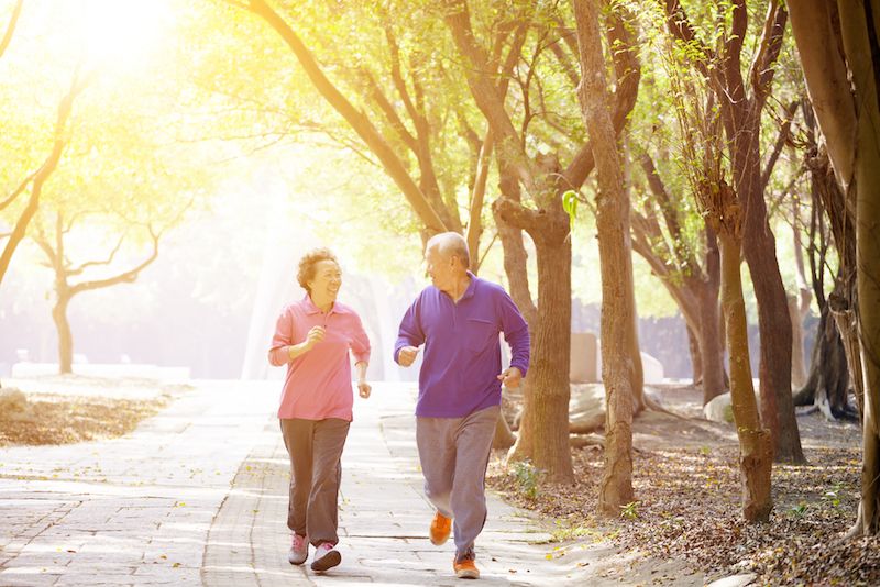 An older couple exercises together