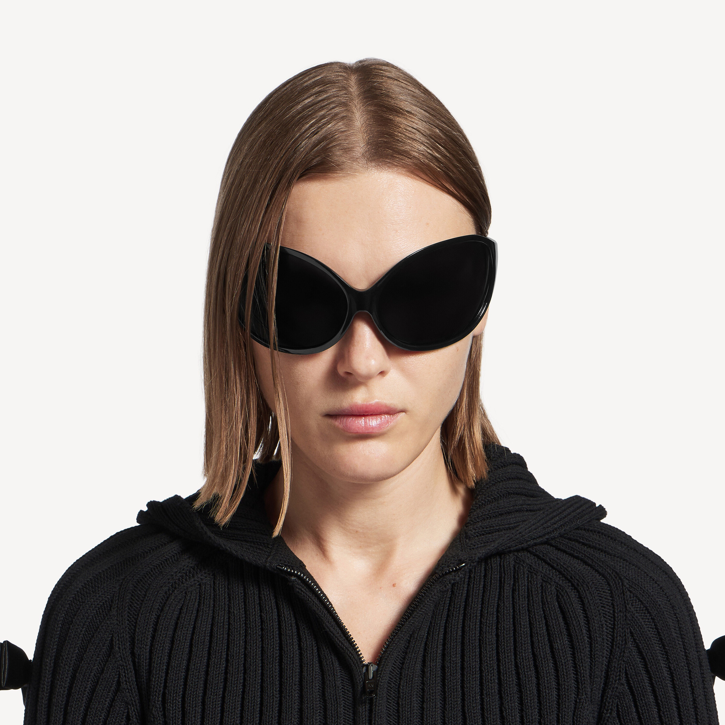 a model wearing balenciaga phantom round sunglasses