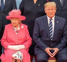 Queen Elizabeth II and US President Donald Trump sit together as they pose for the official family photograph during an event to commemorate the 75th anniversary of the D-Day landings, in Portsmouth, June 5, 2019. (Photo by JACK HILL/POOL/AFP via Getty Images)