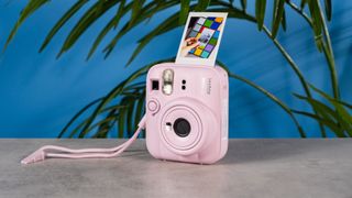 A Candy Pink Fujifilm Instax mini 13 instant camera