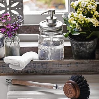 wooden brush white cloth and flower in pots