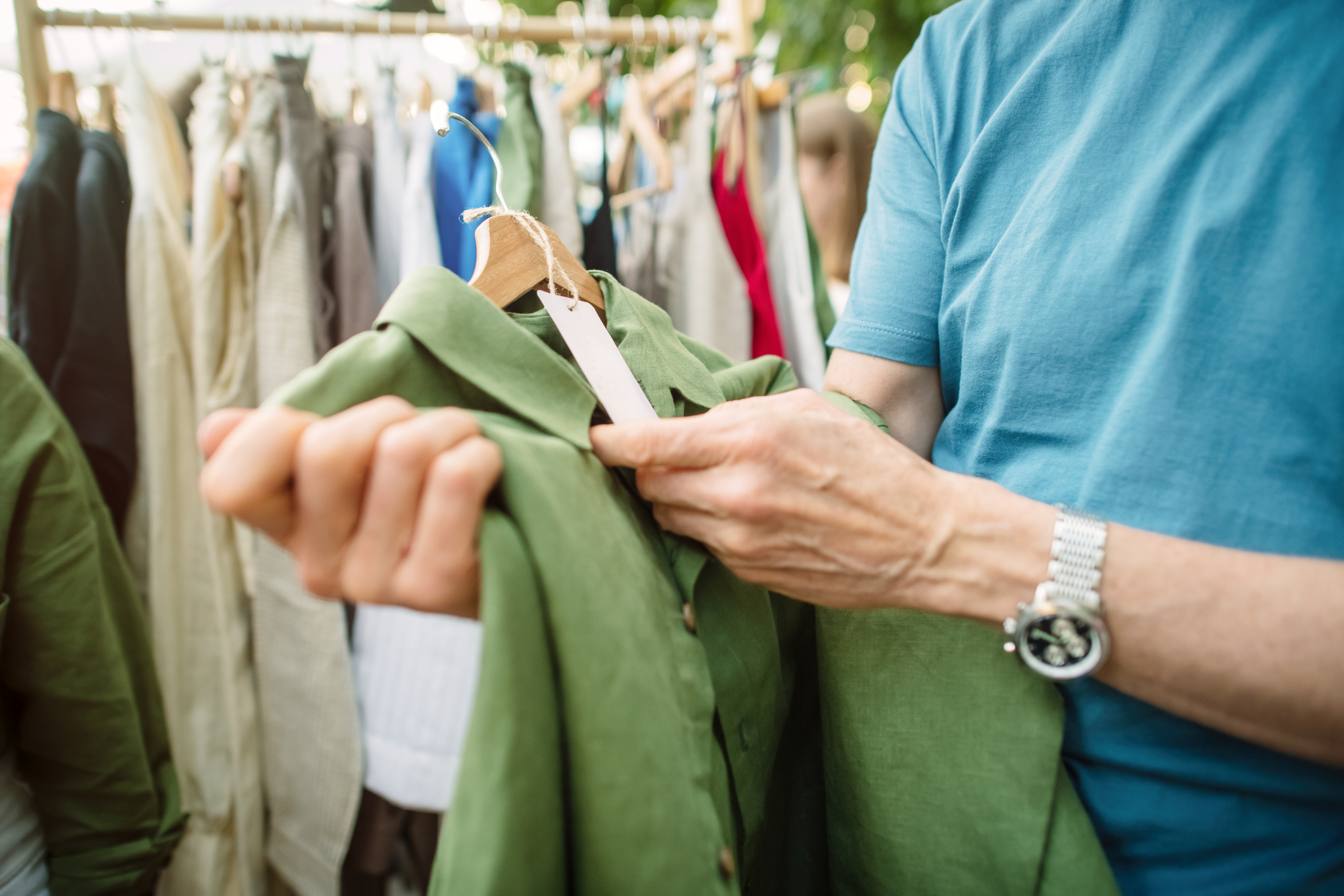 Man shopping at a local or flea market. Sustainable lifestyle and zero waste concept.
