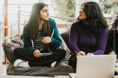 teen and mum looking at laptop