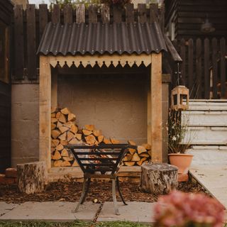 Wooden log shed in garden