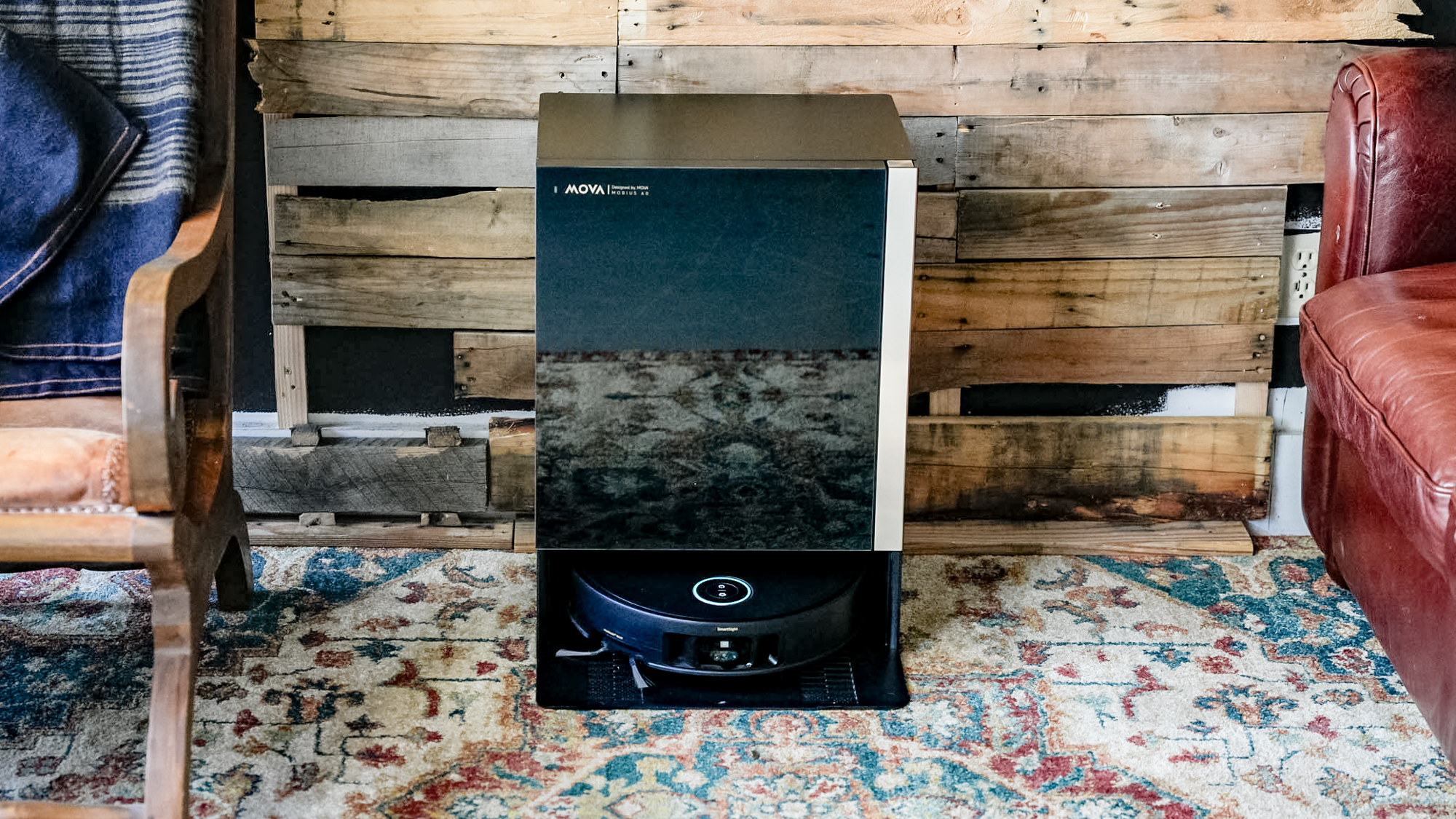 Mova Mobius 60 robot vacuum docked in the base station