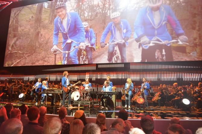 The band plays on while the teams are presented