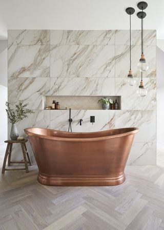 antique copper bath in modern bathroom