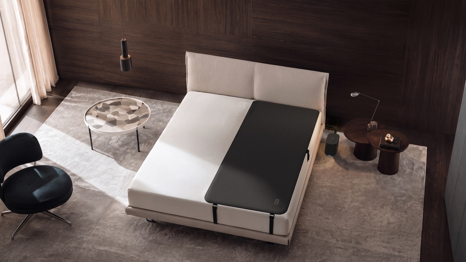 A black Eight Sleep Pod 6 solo cover on a white queen size bed