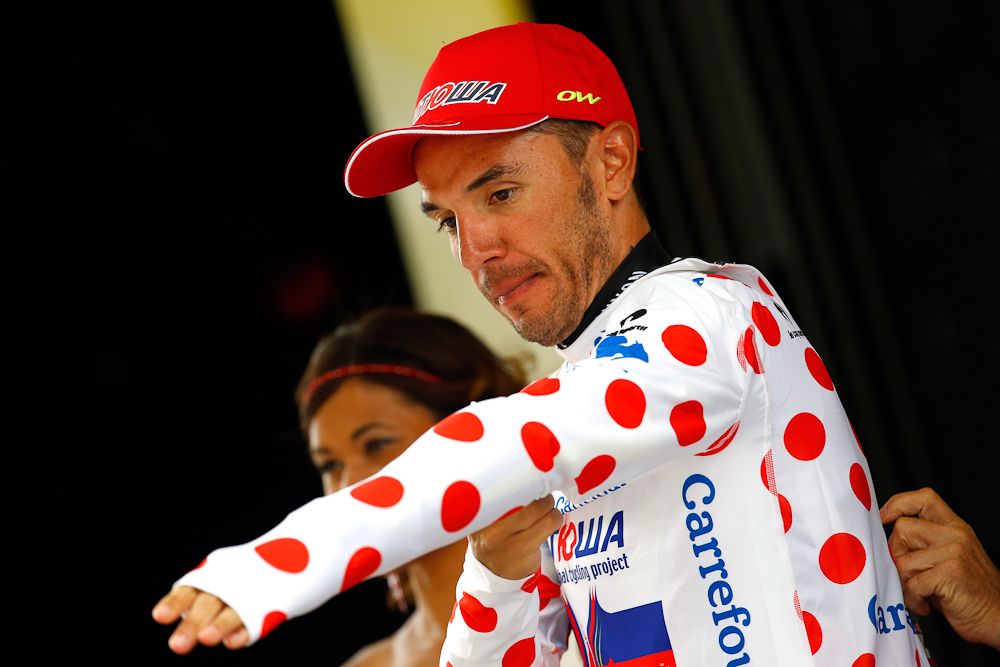Joaquim Rodriguez (Team Katusha) pulls on the polka dot jersey after stage 5.
