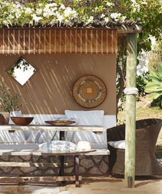 Outdoor dining area with beige walls