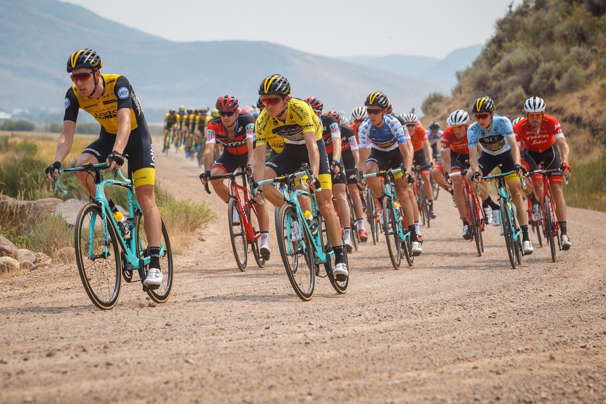Race leader Sepp Kuss and the peloton traverse a grave road during stage 5 in Utah