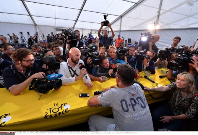 A packed press room