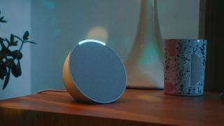 Amazon Echo smart speaker on a bedside table